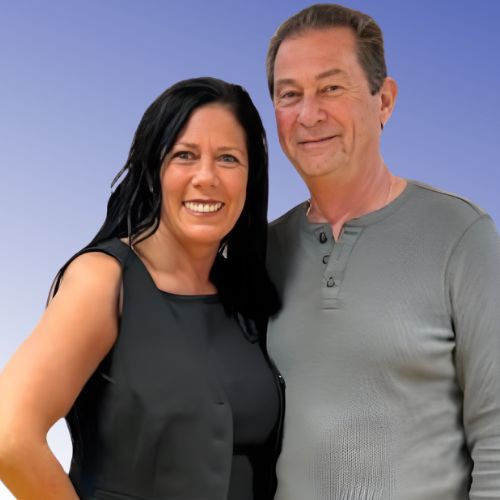 Dark haired woman wearing a dark tank top standing next to a man with short dark hair and a gray long sleeved shirt